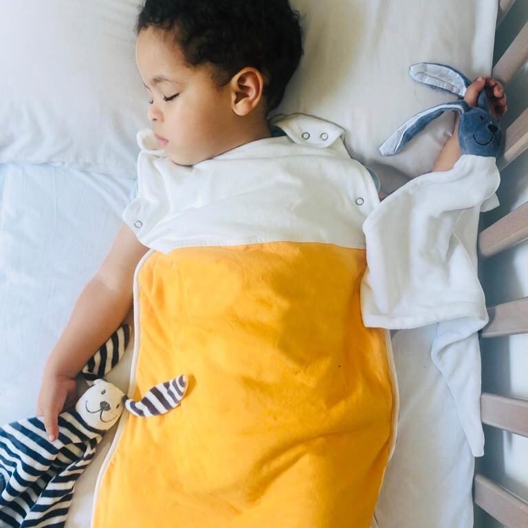 baby sleeps with organic baby comforter in organic baby sleeping bag